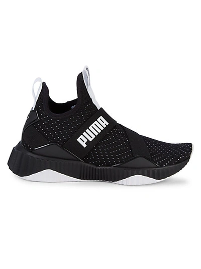 Shop Puma Defy Mid Core Perforated-knit Trainers