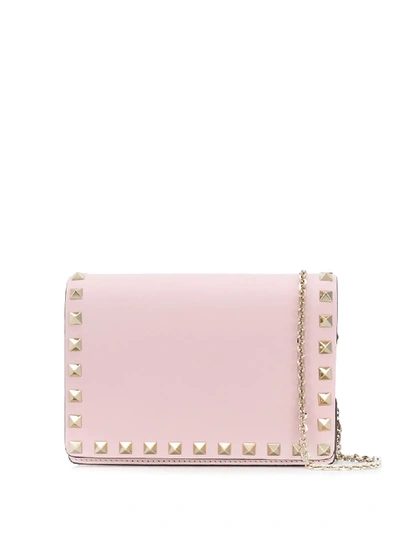 Shop Valentino Mini Rockstud Crossbody Bag In Pink