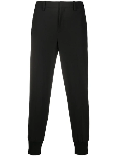 Shop Neil Barrett Low-rise Tapered-leg Trousers In Black