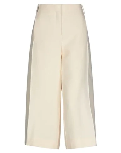 Shop Valentino Cropped Pants & Culottes In Ivory