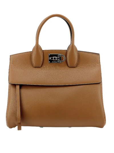 Shop Ferragamo Studio Handbag In Brown