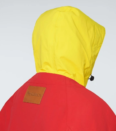 Shop Jw Anderson Jwa Puller Nylon Hooded Jacket In Red