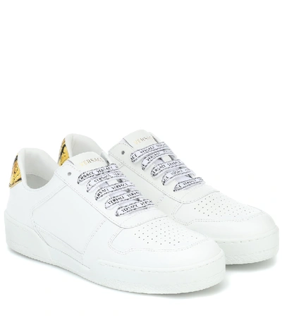 Shop Versace Leather Sneakers In White