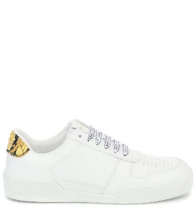 Shop Versace Leather Sneakers In White