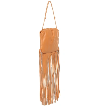 Shop Bottega Veneta Fringe Pouch Leather Bag In Orange