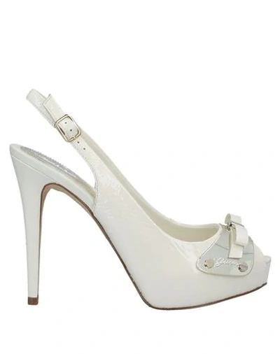 Shop Guess Sandals In Ivory