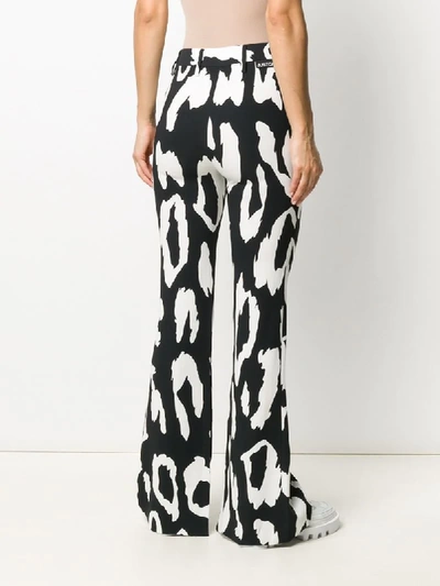 Shop Just Cavalli Leopard-print Flared Trousers In Black