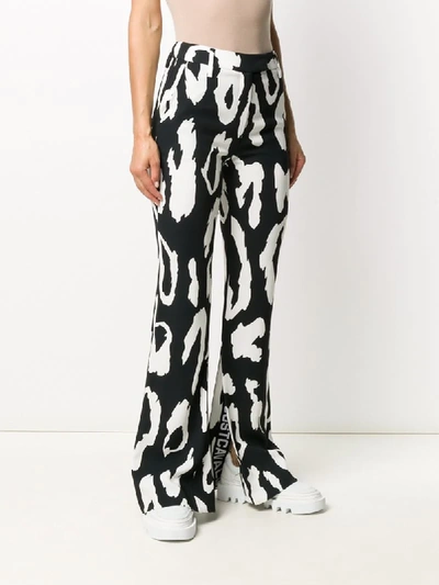 Shop Just Cavalli Leopard-print Flared Trousers In Black