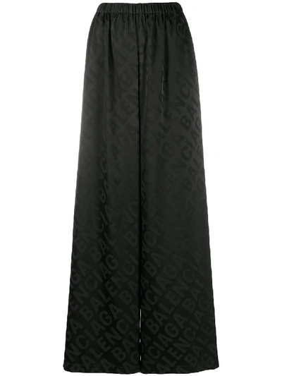 Shop Balenciaga Logo-pattern Wide-leg Trousers In Black