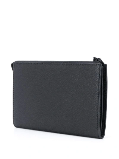 Shop Ferragamo Zipped Logo Clutch Bag In Black