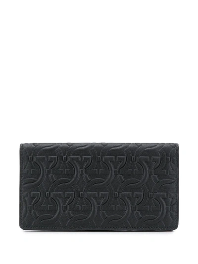 Shop Ferragamo Embossed Gancini Wallet In Black