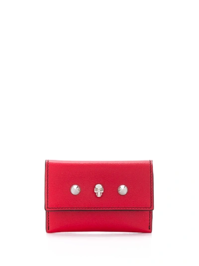ALEXANDER MCQUEEN FLAP CARD HOLDER WITH SKULL AND STUDS IN 6013 DEEP RED