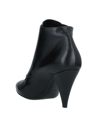 Shop Saint Laurent Ankle Boots In Black