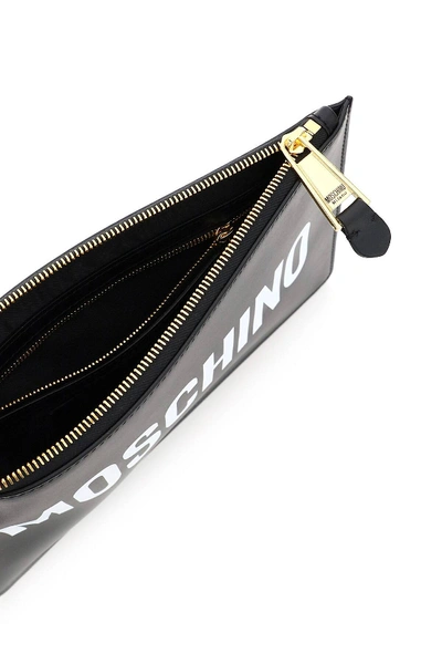 Shop Moschino Logo Print Clutch In Black,white