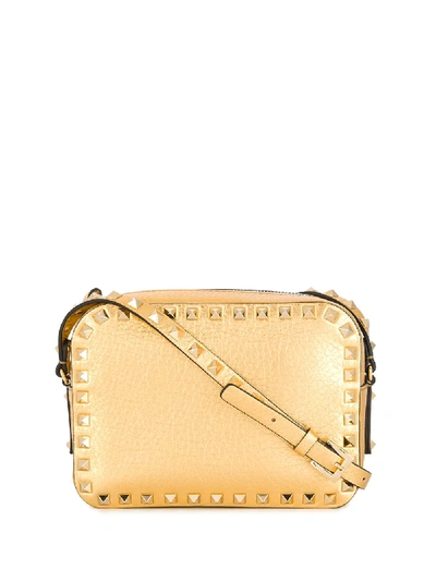 Shop Valentino Small Rockstud Crossbody Bag In Gold