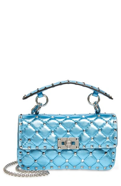 Shop Valentino Small Rockstud Spike Metallic Leather Shoulder Bag In Cerulean/ Palladio