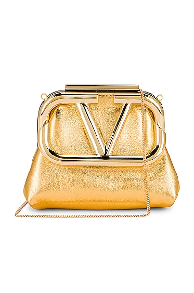 Shop Valentino Mini Clutch In Soft Gold