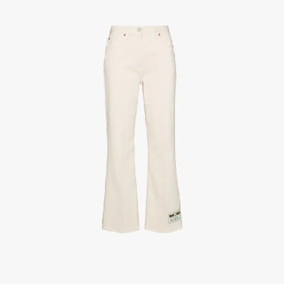 Shop Gucci Logo Patch Flared Jeans In White