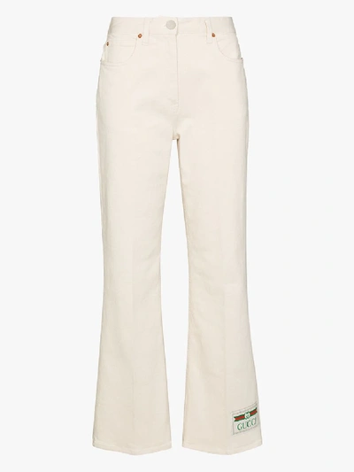 Shop Gucci Logo Patch Flared Jeans In White