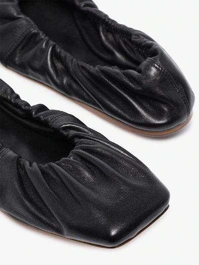 Shop Ganni Ruched Leather Ballet Pumps In Black