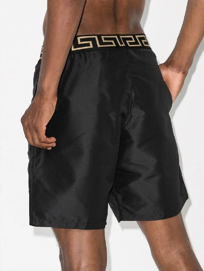 Shop Versace 'greca' Badeshorts In Black
