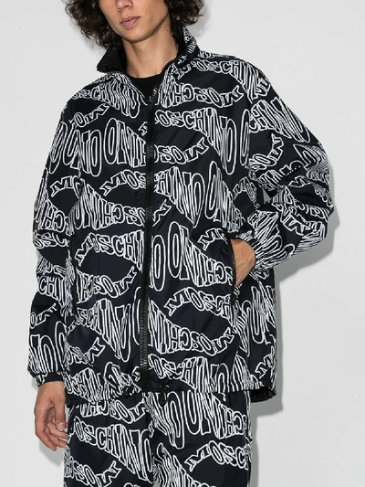 Shop Moschino Logo Print Shell Jacket In Black