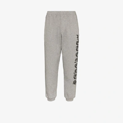 Shop Vetements Gothic Logo Track Pants In Grey