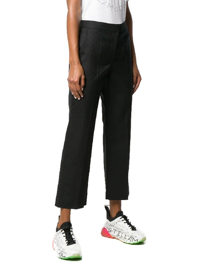 Shop Stella Mccartney All-over Logo Black Pants