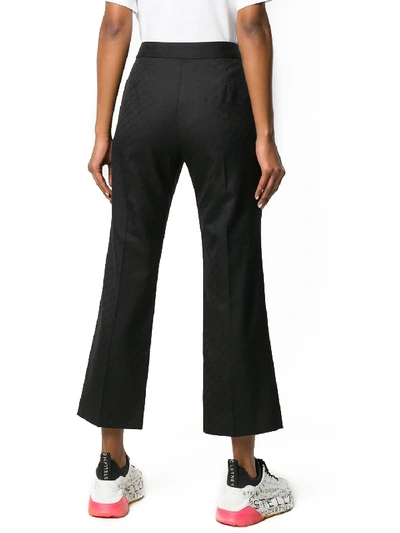 Shop Stella Mccartney All-over Logo Black Pants