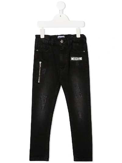 Shop Moschino Distressed Skinny Jeans In Black