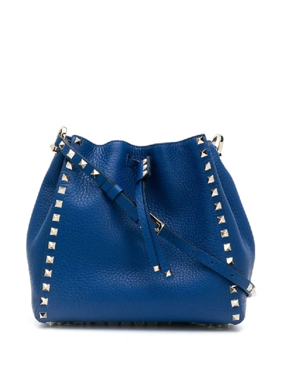 Shop Valentino Rockstud Bucket Bag In Blue