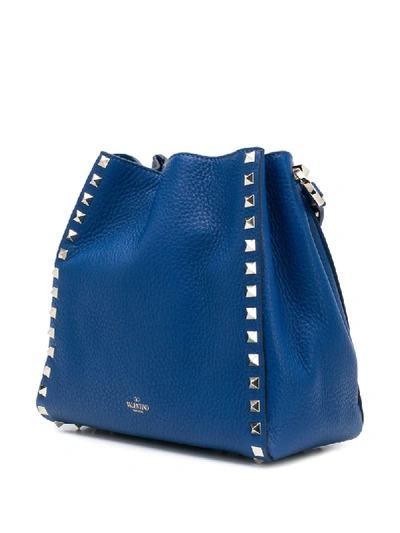 Shop Valentino Rockstud Bucket Bag In Blue