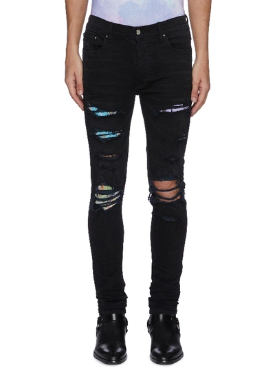 Shop Amiri Hawaiian Print Patch Distressed Skinny Jeans In Black