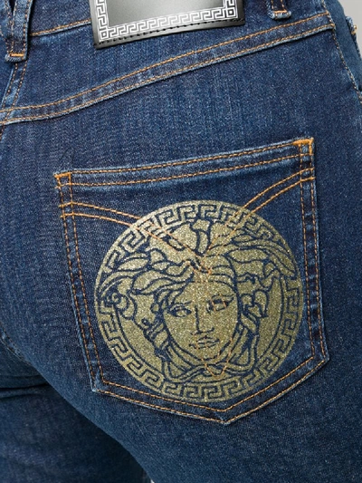 Shop Versace Medusa Print Skinny Jeans In Blue