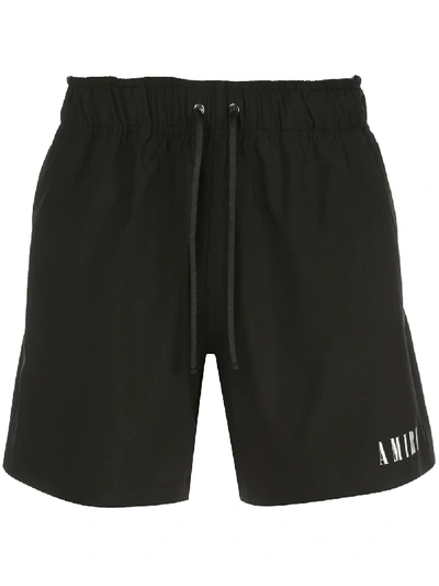 Shop Amiri Logo Print Swim Shorts In Black