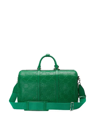 Shop Gucci Logo-embossed Holdall In Green