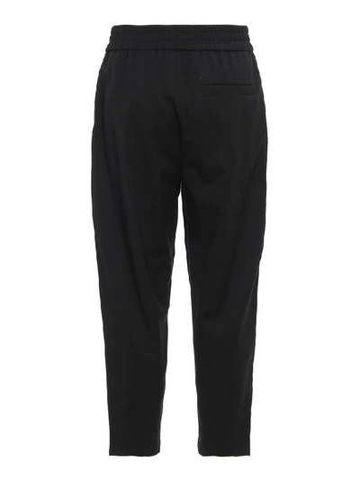 Shop Moschino Logo Band Trousers In Black