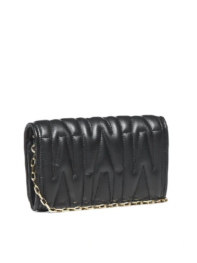 Shop Moschino M Plaque Quilted Clutch Bag In Black
