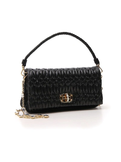 Shop Miu Miu Crystal Embellished Handbag In Black