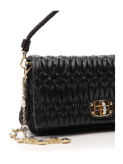 Shop Miu Miu Crystal Embellished Handbag In Black