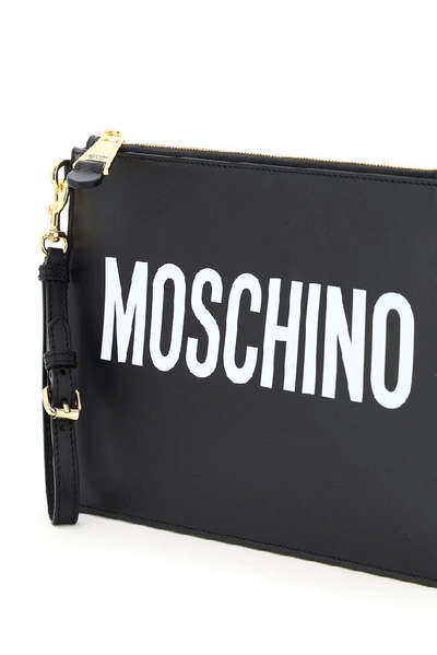 Shop Moschino Logo Zipped Clutch Bag In Black