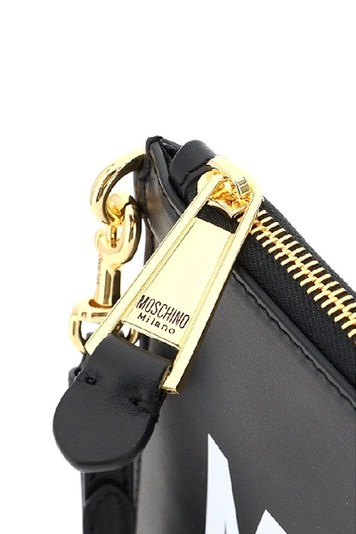 Shop Moschino Logo Zipped Clutch Bag In Black