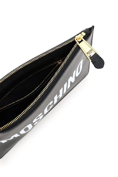 Shop Moschino Logo Zipped Clutch Bag In Black