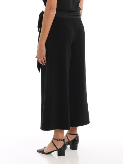 Shop Moschino Maxi Bow Palazzo Trousers In Black