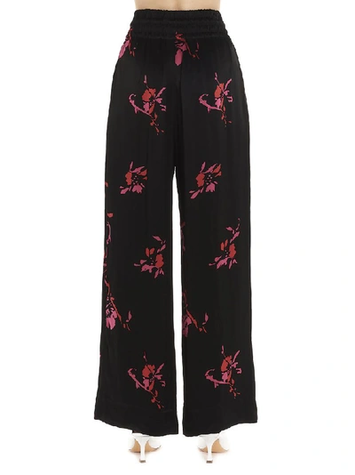 Shop Ganni Floral Print Pants In Black