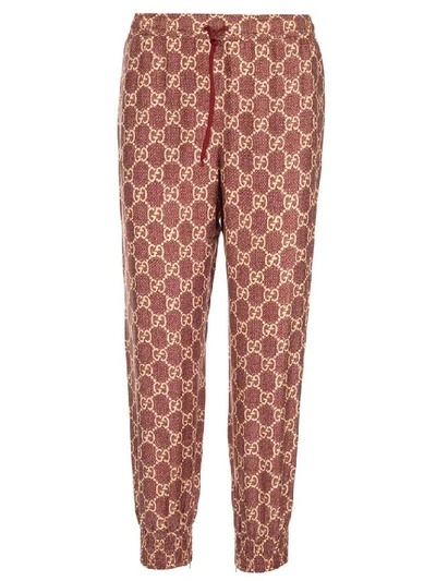 Shop Gucci Gg Supreme Print Pants In Brown
