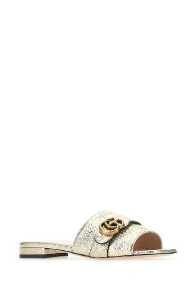 Shop Gucci Double G Slides In Gold