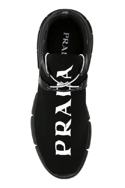 Shop Prada Logo Knit Sneakers In Black