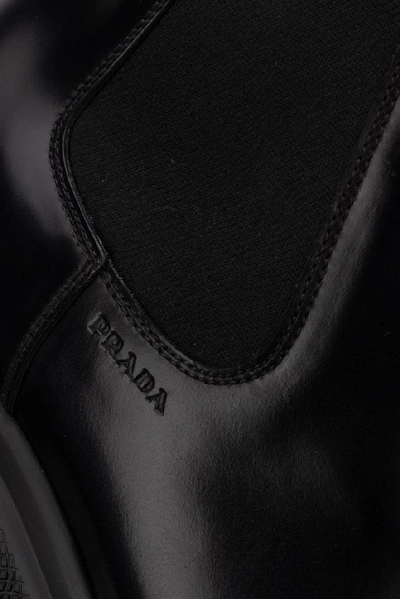 Shop Prada Logo Chelsea Ankle Boots In Black