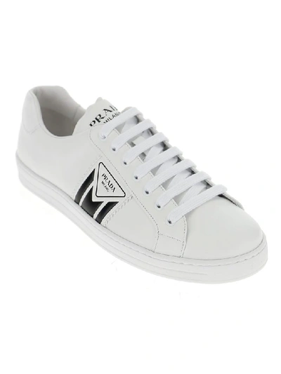 Shop Prada Embossed Logo Sneakers In White